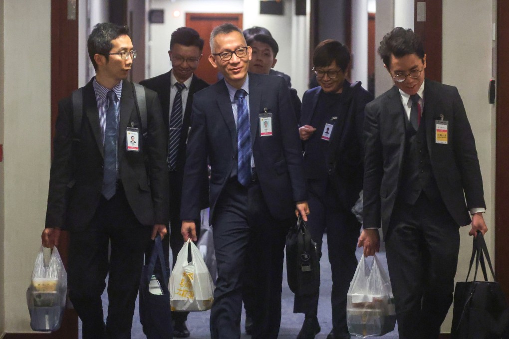 Officials during their lunch break following meetings on the security bill at the Legislative Council. Photo: Edmond So