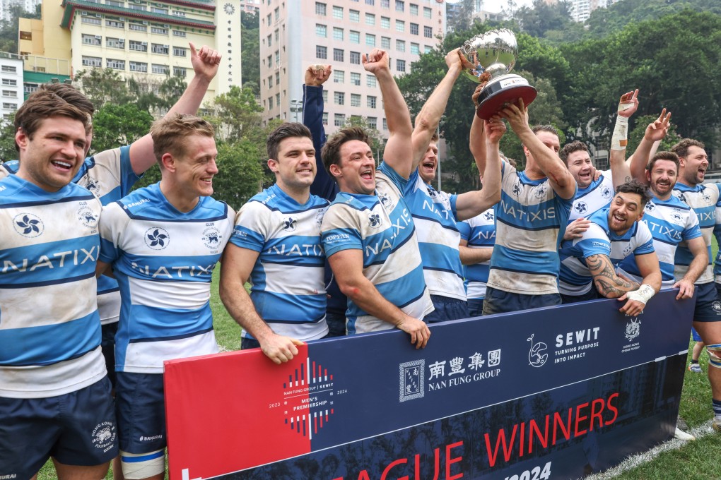 Hong Kong Football Club players celebrate with the trophy on Saturday. Photo: Yik Yeung-man