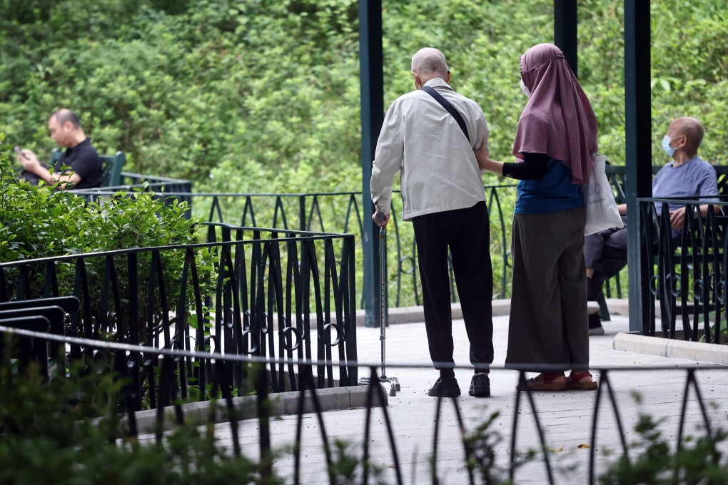 An elderly resident takes a walk in a park in Jordan. Bluetooth tracking devices are distributed for free to households with family members suffering from dementia, as part of Project Pinpoint. Photo: K. Y. Cheng