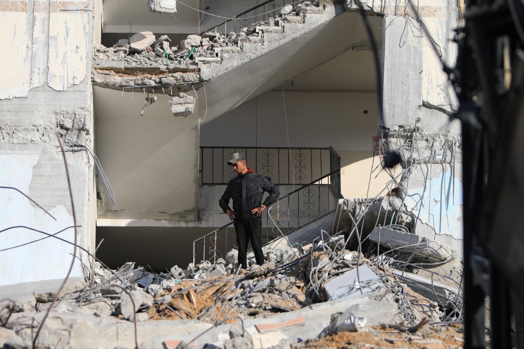 A Palestinian inspects destroyed buildings after intense airstrikes in the southern Gaza Strip city of Rafah. Photo: Xinhua