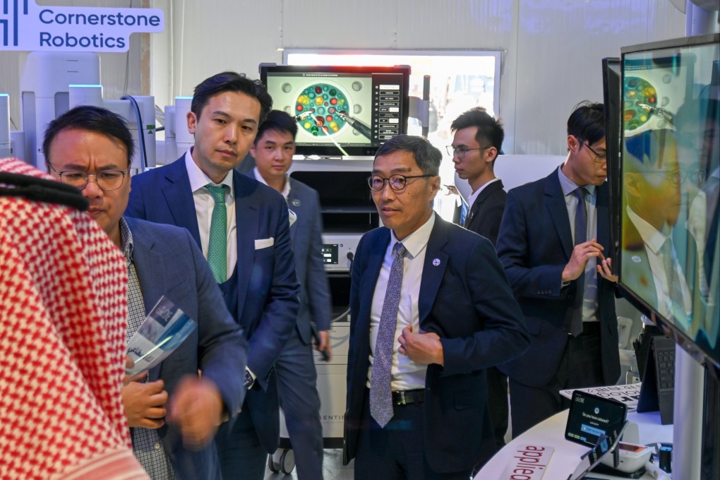 Tsangs Group Chairman Patrick Tsang (centre left) tours the Hong Kong pavilion at the Leap 2024 conference in Riyadh, Saudi Arabia, with Albert Wong Hak-keung, CEO of Hong Kong Science and Technology Park, on March 4, 2024. Photo: SCMP/Matt Haldane