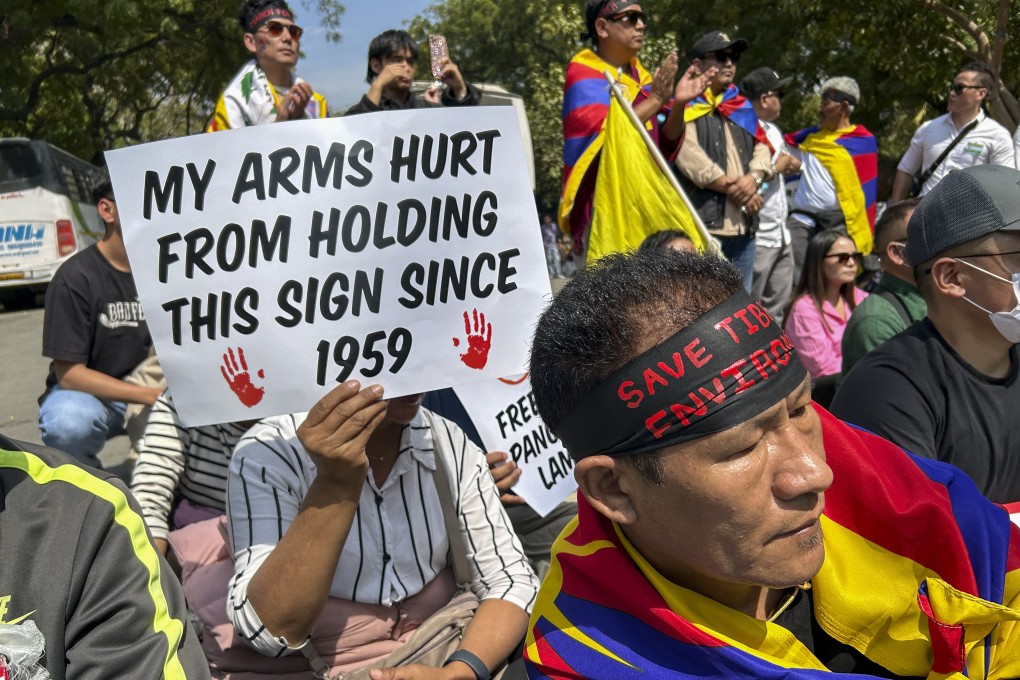 Exiled Tibetans attend a rally in Delhi, India, on Sunday, to mark the anniversary of the 1959 Tibetan uprising in Lhasa. Photo: AP