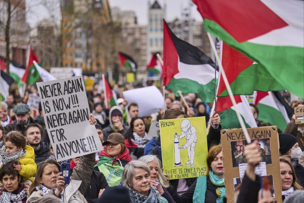 Demonstrators protest against Israel’s President Isaac Herzog attending the opening of the National Holocaust Museum in Amsterdam on Sunday. Photo: AP