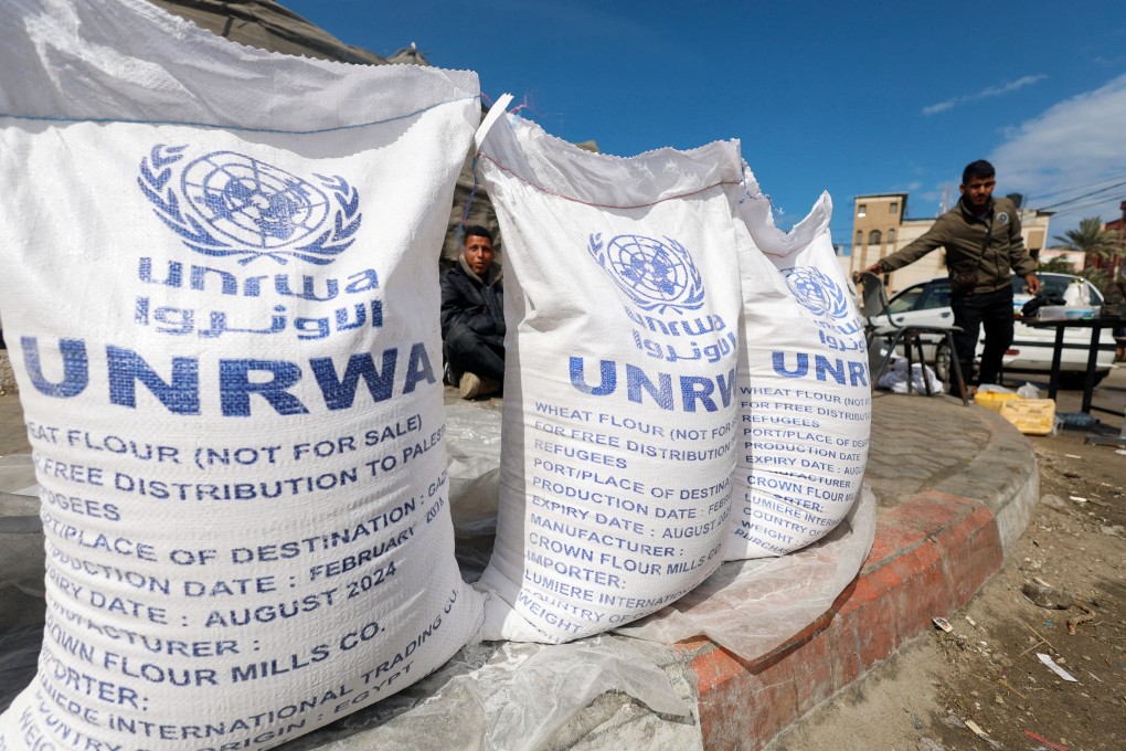 Displaced Palestinians wait to receive UNRWA aid in Rafah, in the southern Gaza Strip, on Thursday. Photo: Reuters