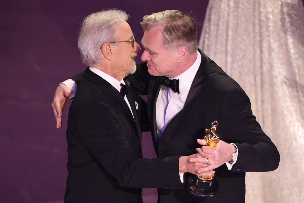 Christopher Nolan accepts the Oscar for best director for Oppenheimer from presenter Steven Spielberg during the 96th Academy Awards ceremony in Hollywood. The film went on to win best director, and earned five other Oscars. Photo: Reuters