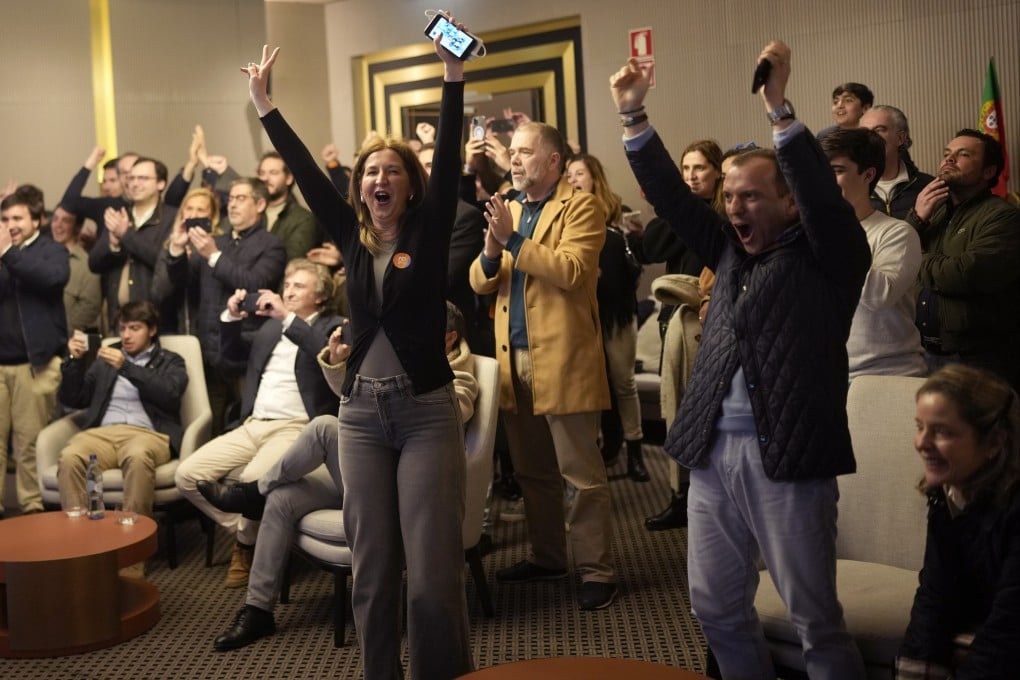 Supporters of the centre-right Democratic Alliance coalition party at their party headquarters in Lisbon, Portugal on Sunday. Photo: AP