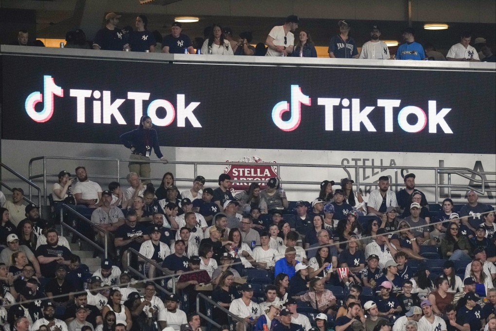 Fans sit under a TikTok ad at a baseball game at Yankee Stadium on April 14, 2023. Photo: AP