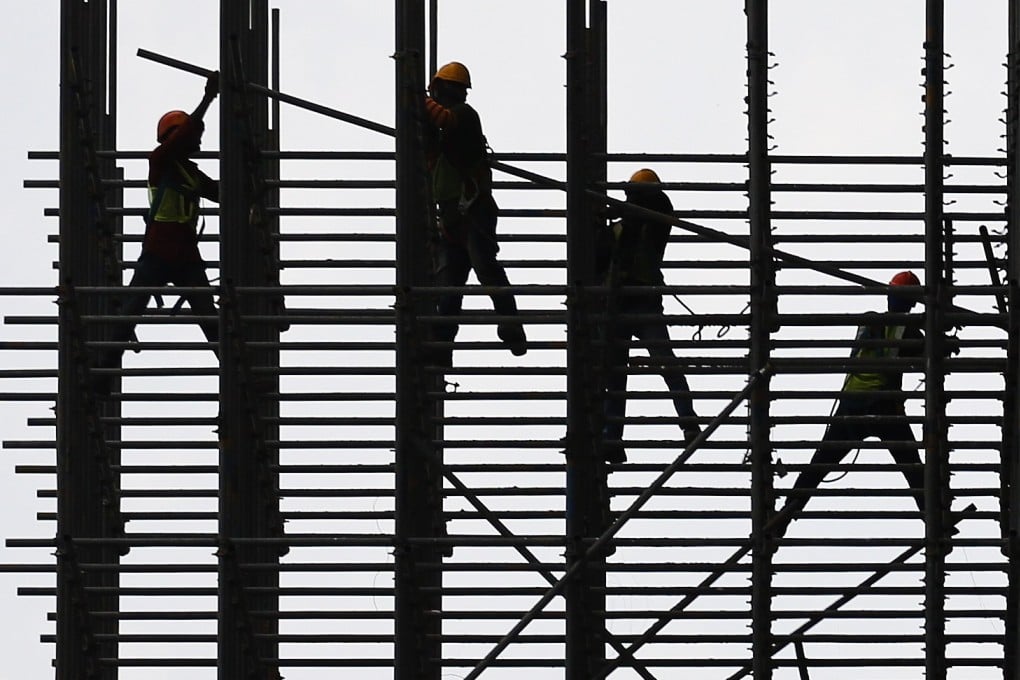 Construction workers in Kuala Lumpur. Migrant workers have been instrumental in the rapid growth of Malaysia’s gleaming skyscrapers and infrastructure projects. Photo: EPA-EFE