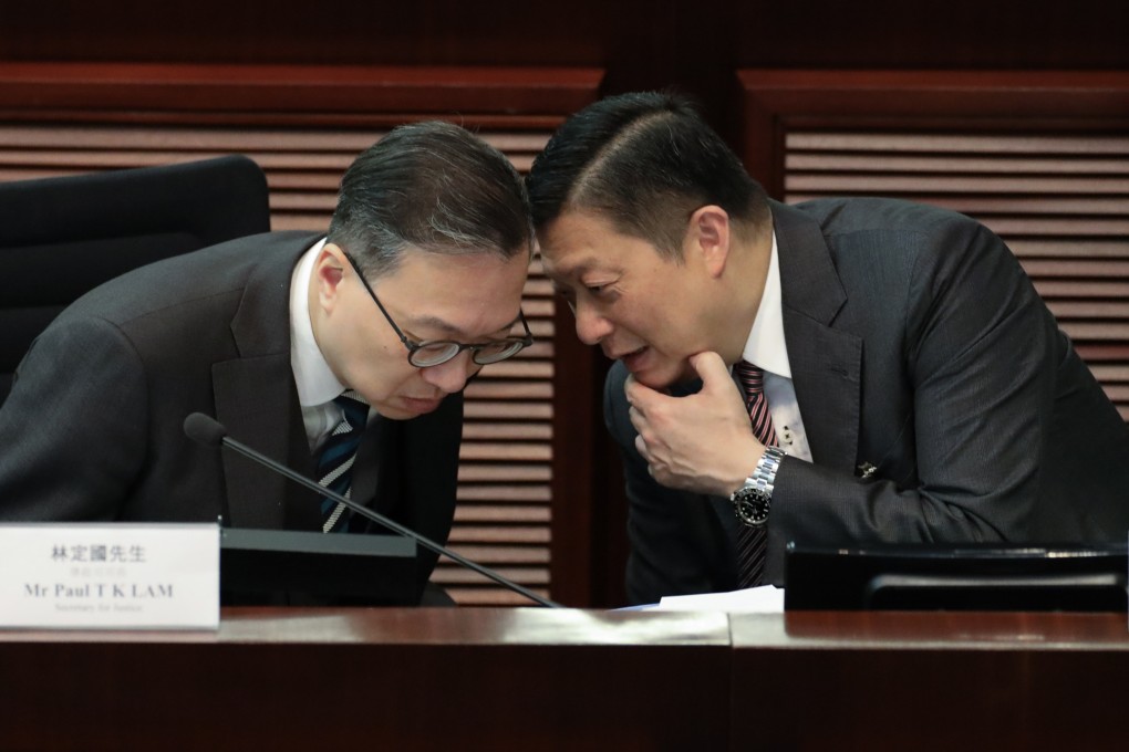 Secretary for Justice Paul Lam (left) and Secretary for Security Chris Tang discuss the Safeguarding National Security Bill at the Legislative Council Complex. Photo: Sun Yeung