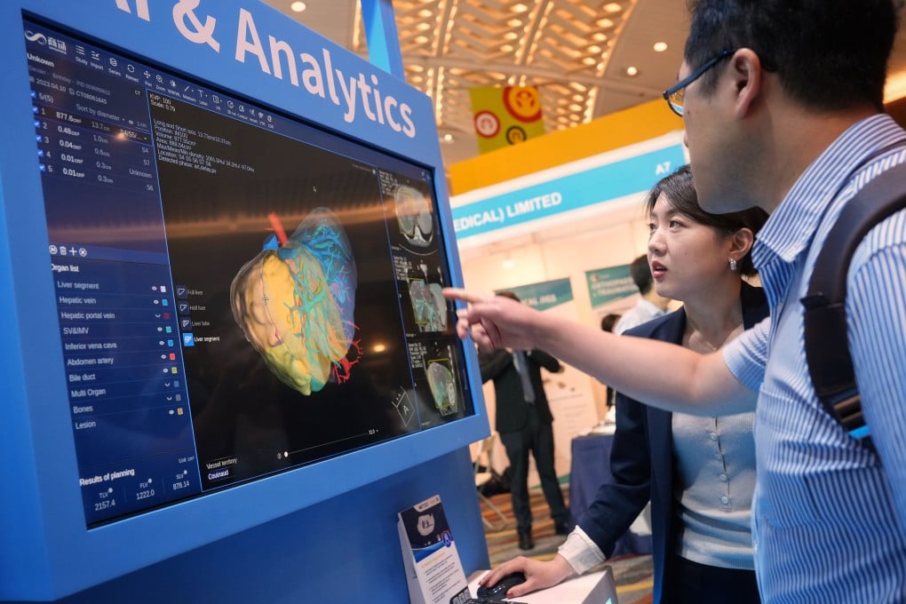 People attend the first day of the Hong Kong International Medical and Healthcare Fair, featuring more than 300 local and foreign exhibitors from the fields of biotechnology, hospital equipment, rehabilitation and elderly care, and others, at the Hong Kong Convention and Exhibition Centre in Wan Chai on May 16, 2023. Photo: Elson Li