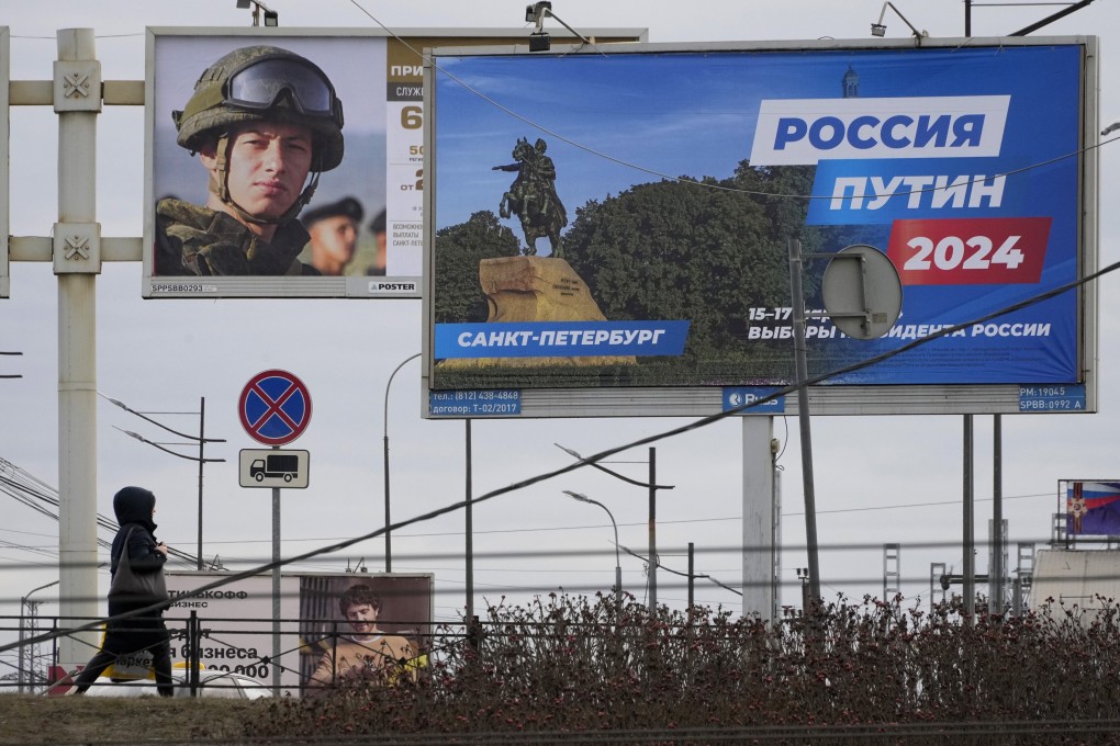 A billboard in St Petersburg, Russia, promoting the presidential election and another promoting contract military service in the Russian army. Photo: AP