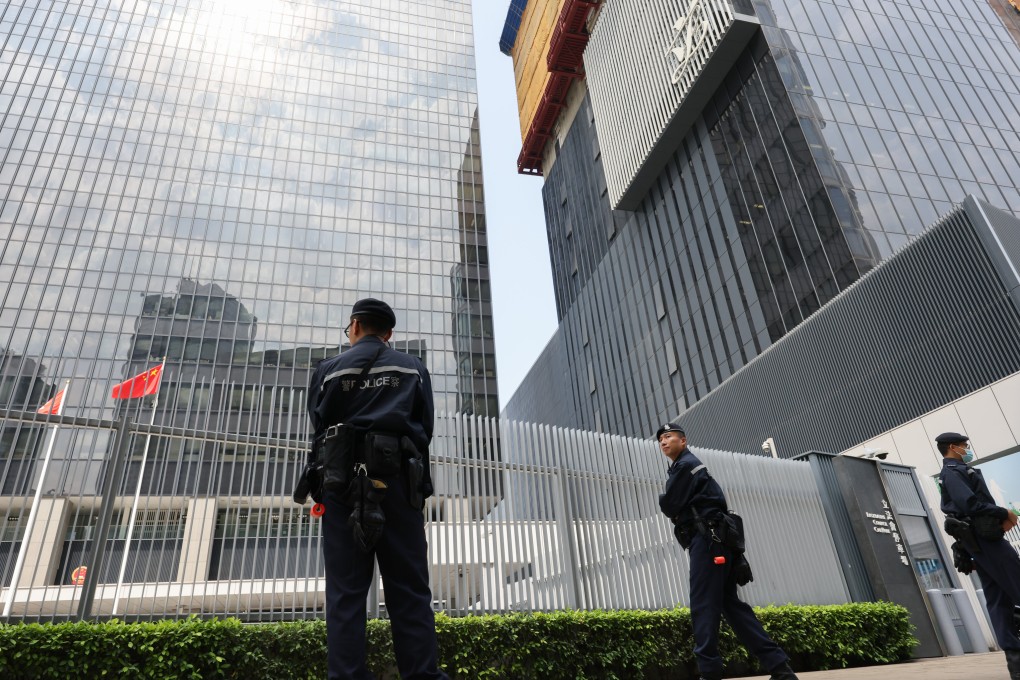 Police officers stand guard outside the Legislative Council as lawmakers debate the domestic national security bill. Photo: Jelly Tse