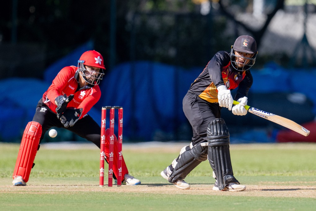 Papua New Guinea’s Sese Bau, the man of the match, plays his shot watched by Hong Kong wicketkeeper Zeeshan Ali. Photo: Panda Man Chung Yan