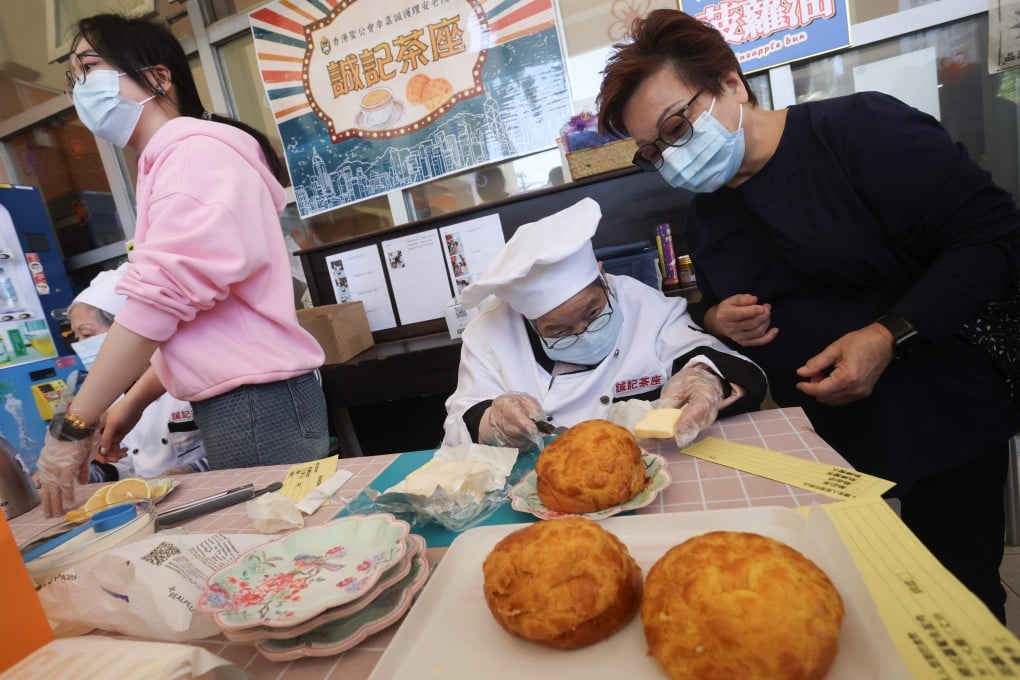 Mandy Lau watches over her 93-year-old Wong Shui-ying at Shing Kee Cafe, which has pineapple buns among items on the menu. Jonathan Wong