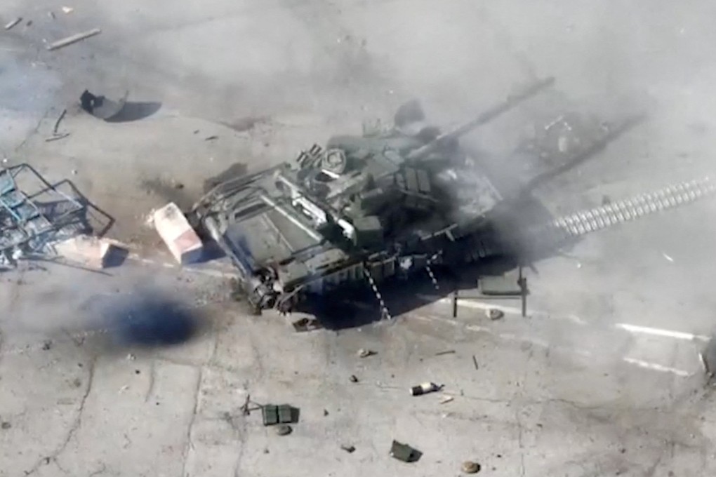 A destroyed tank at a border crossing between Russia and Ukraine near the village of Nekhoteevka in the Belgorod Region, Russia. Photo: Russian Defence Ministry via Reuters
