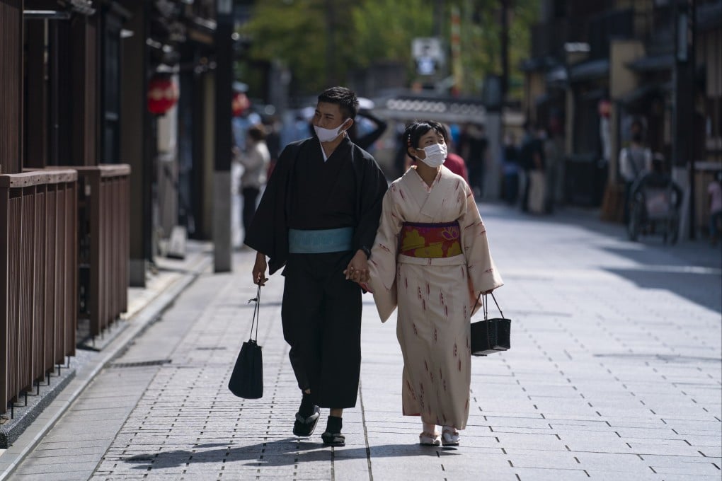 A Japanese couple walks in the Gion area of Kyoto. More Japanese men say they are “fed up” with “manufactured” occasions such as White Day. Photo: EPA-EFE