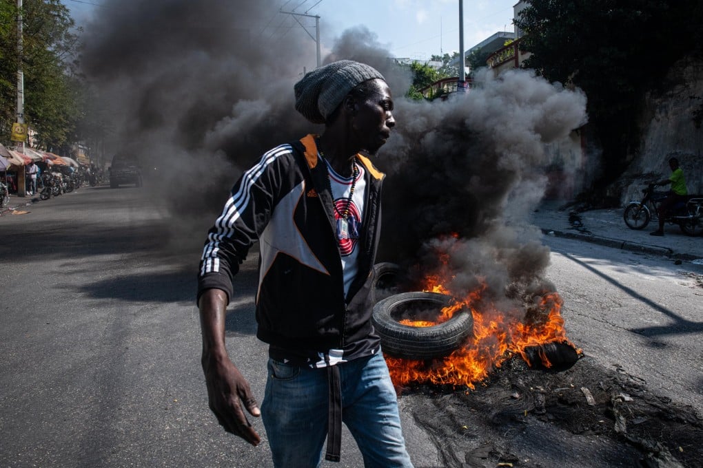 Demonstrators set tyres on fire during a protest in Port-au-Prince, Haiti, on Tuesday. Photo: EPA-EFE