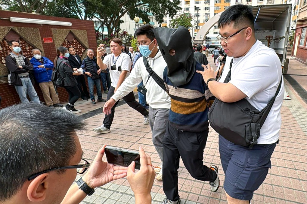 Officers take away one of the suspects after Wednesday’s undercover operation. Photo: Handout