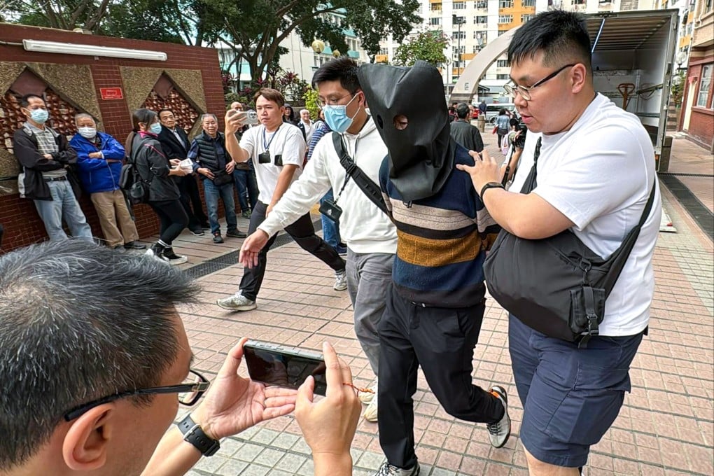Officers take away one of the suspects after Wednesday’s undercover operation. Photo: Handout