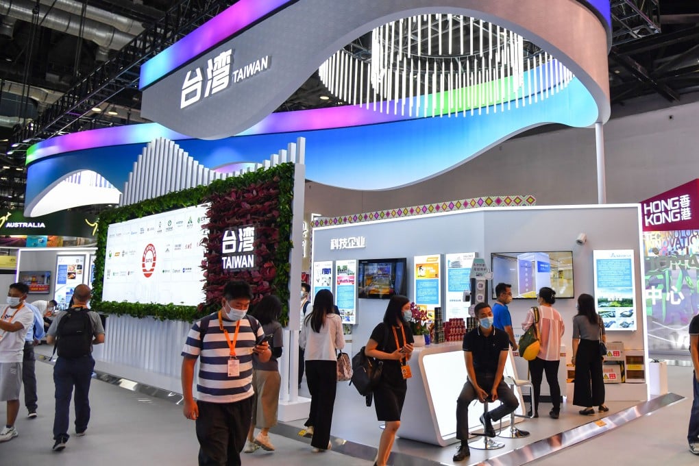 People visit a Taiwan booth at a 2022 trade expo in Beijing. A rising number of surveyed Taiwanese firms say they are considering cuts to their mainland China operations as risks mount. Photo: Getty Images