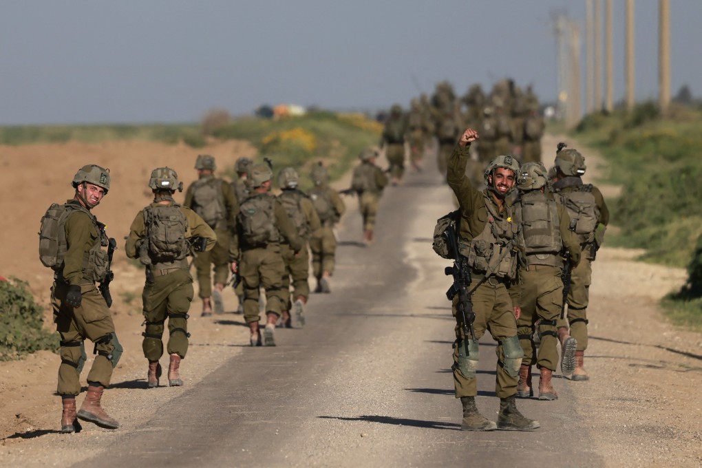 Israeli soldiers after coming out from the Gaza Strip, near the border in southern Israel on Tuesday. Photo: AFP