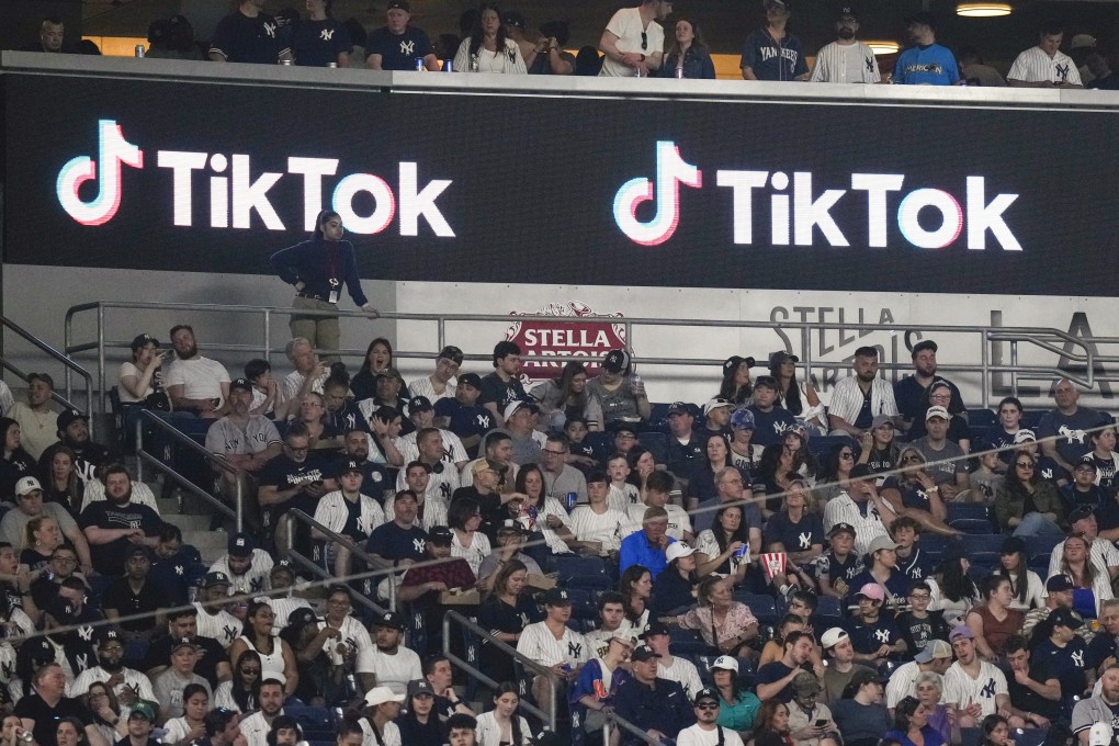 Fans sit under a TikTok ad at a baseball game at Yankee Stadium, April 14, 2023, in New York. Photo:
AP Photo