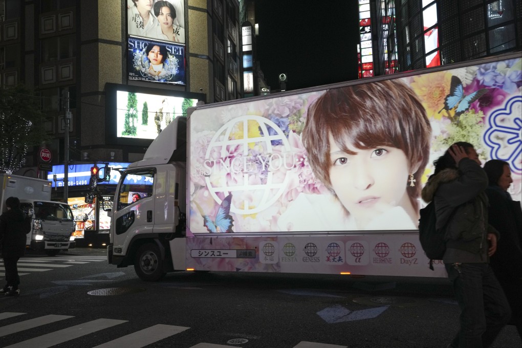 A promotional vehicle of a ‘Host Club’ runs though Kabukicho in Tokyo. Japan has a booming multibillion-dollar adult industry, which in recent years had been rocked by allegations that women were forced to perform sex acts on films against their will. Photo: EPA-EFE