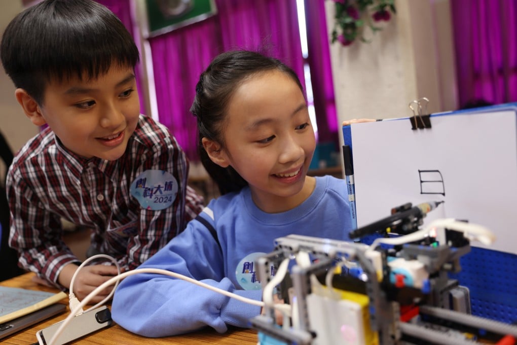 Two primary school students in Hong Kong show their invention at an expo that showcases the technological innovations by student inventors, on January 16 in Hong Kong’s Tai Po district. Photo: Yik Yeung-man