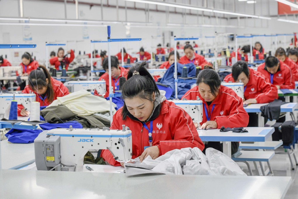 Workers sew at a workshop of a garment company in Zunhua, north China’s Hebei Province. Photo: Xinhua