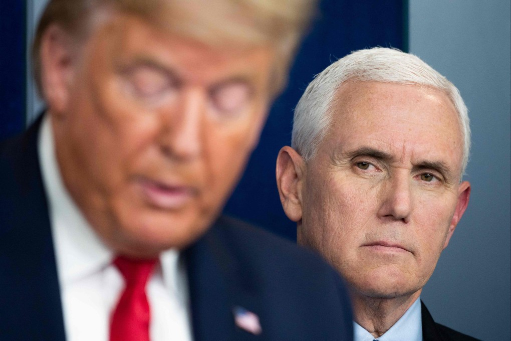 US Vice President Mike Pence listens as US President Donald Trump speaks during a press briefing at the White House in March 2020. Photo: AFP
