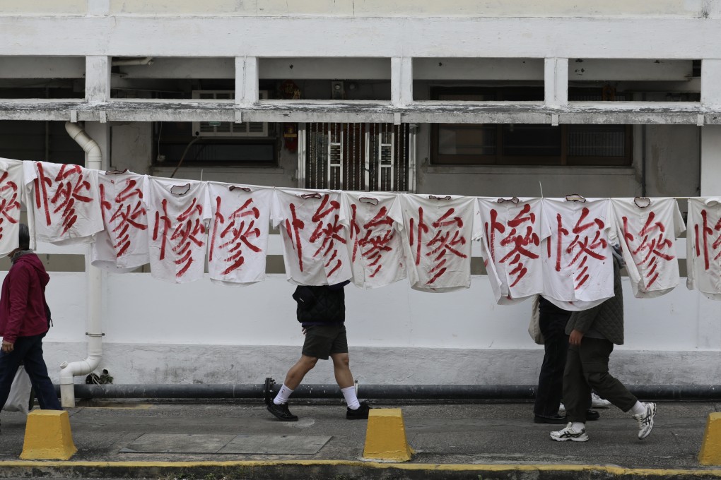 A banner hangs in protest against the relocation of residents from the Tai Hang Sai Estate. Two of the site’s eight blocks were built as early as 1964. Photo: Xiaomei Chen