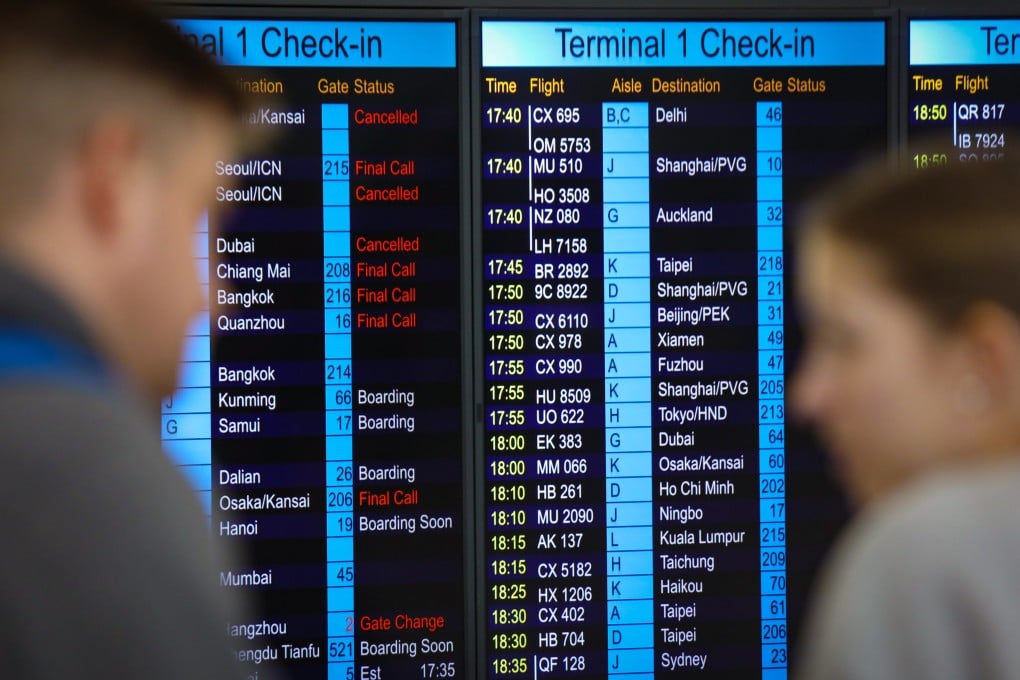 Passengers check information at Hong Kong International Airport. A Legco panel will further discuss the airline’s spate of flight cancellations on Friday. Photo: Xiaomei Chen