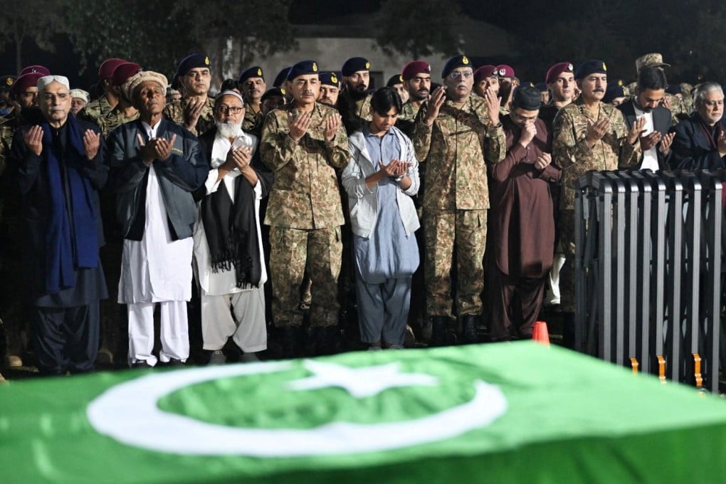 Pakistan President Asif Ali Zardari (left), army officers and others attend the funeral of Lieutenant Colonel Syed Kashif Ali and Captain Muhammad Ahmed Badar, who were killed in an attack on a military post in North Waziristan district on Saturday. Photo: Handout via Reuters