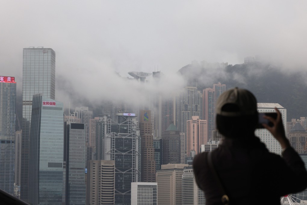 Fog over buildings in Central. Visibility at Waglan Island, the city’s southeastern-most tip, has fallen to about 100 metres. Photo: Jelly Tse