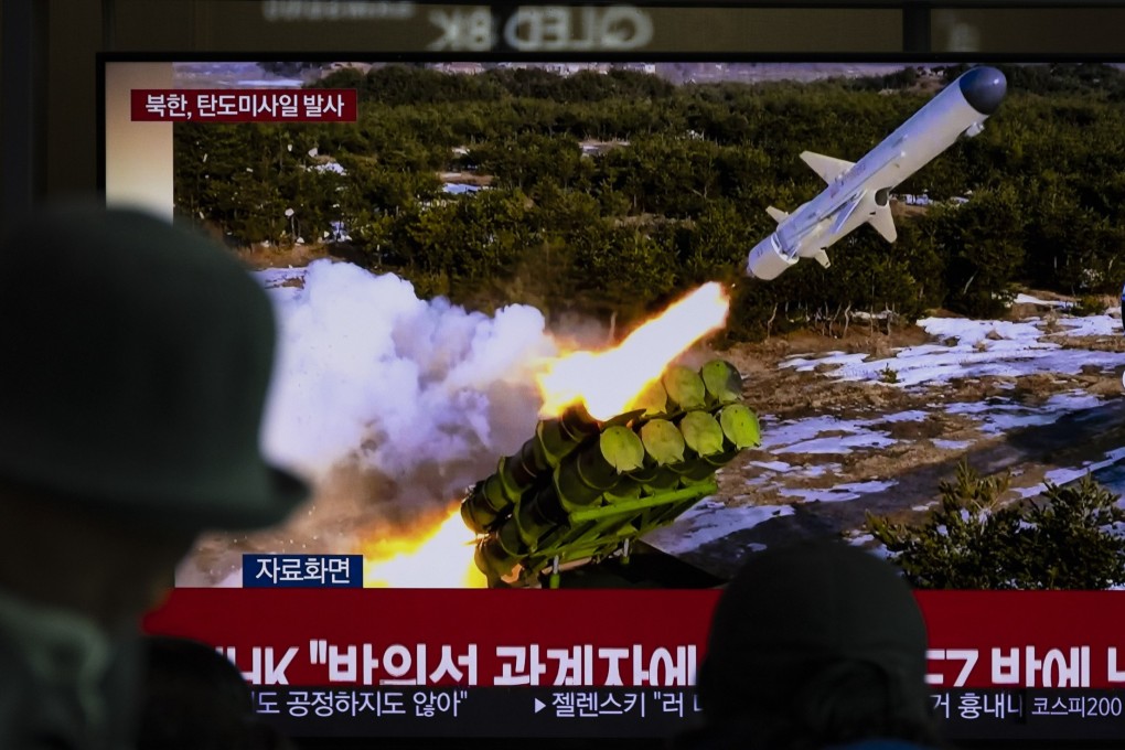Commuters at a railway station in Seoul watch a broadcast about Monday’s missile launch by North Korea. Photo: EPA-EFE