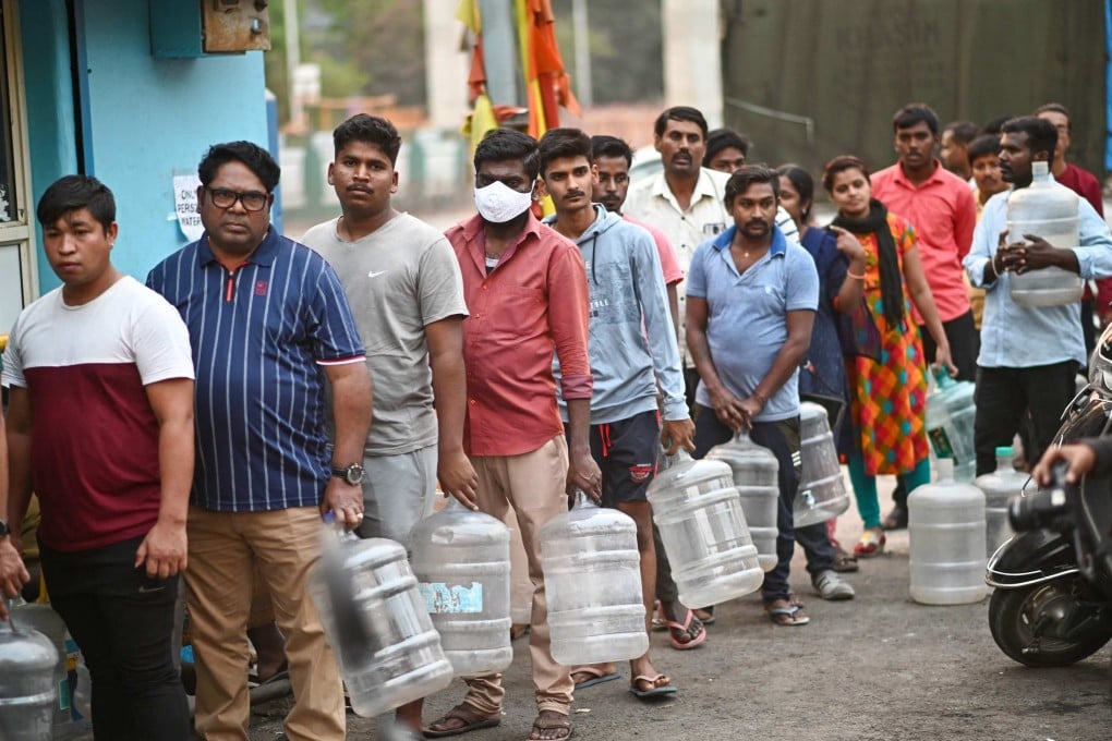 Residents of Bengaluru queue to collect drinking water on Thursday amid the city’s ongoing water crisis. Photo: AFP