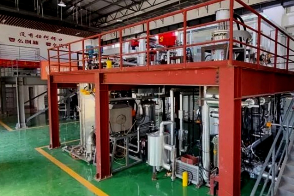 China’s experimental lithium-cooled space nuclear reactor beneath a sign that reads “Innovate or perish. No excuses”. Photo: Chinese Academy of Sciences