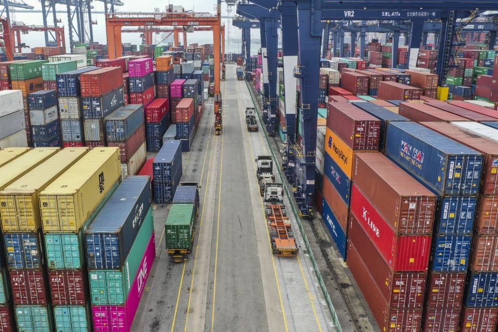 Trucks passing through containers at the Hong Kong Container Terminal, situated in the Kwai Chung-Tsing Yi basin on May 17, 2019. Photo: SCMP / Roy Issa