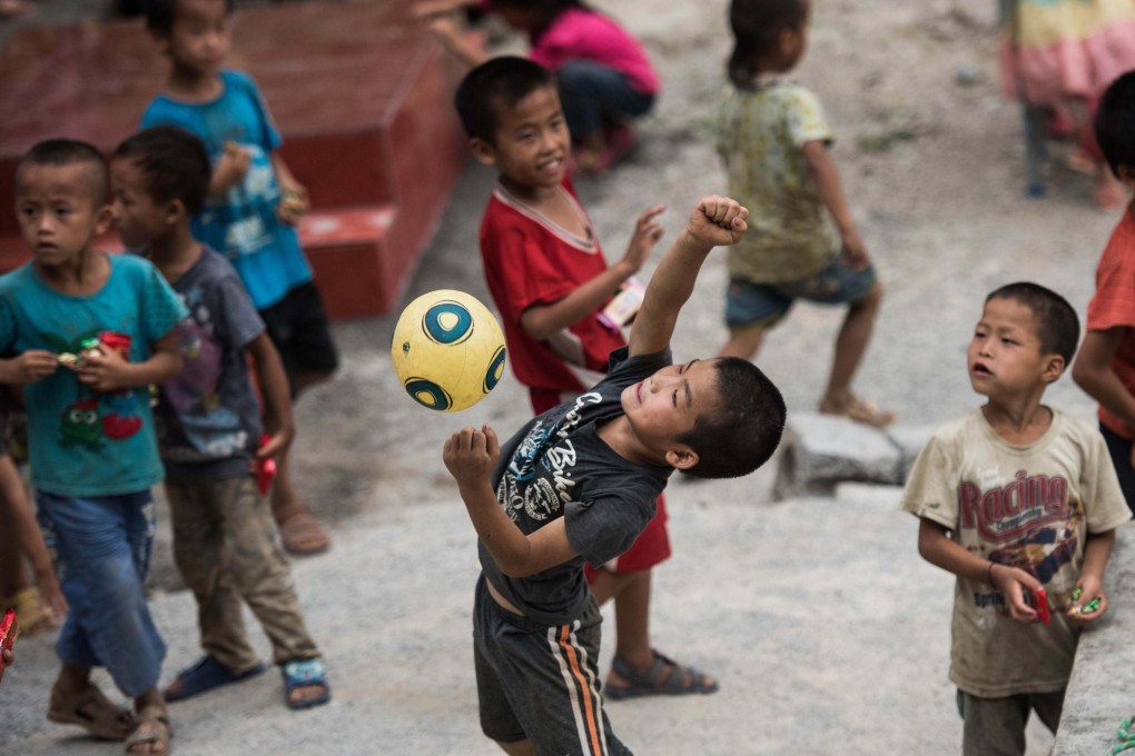 Children play in the schoolyard of Chongshan Primary School in Longfu township, in southern China’s Guangxi, in 2015. Photo: AFP