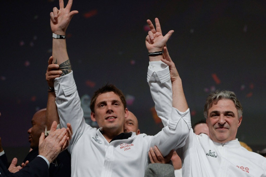 Fabien Ferré (left) celebrates the award of three Michelin stars for his restaurant La Table du Castellet in southeast France with Jérôme Banctel, whose restaurant, Le Gabriel, just elevated to three-star status in the 2024 Michelin Guide France. Photo: AFP