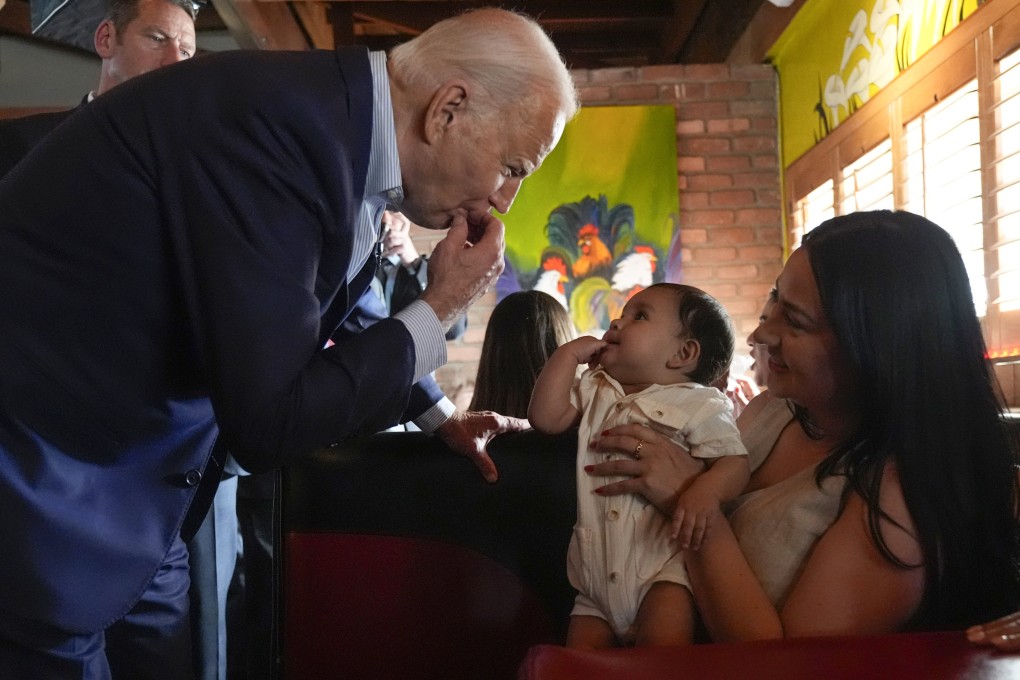 US President Joe Biden mimics a baby at a Mexican restaurant in the Phoenix area, Arizona. Photo: AP