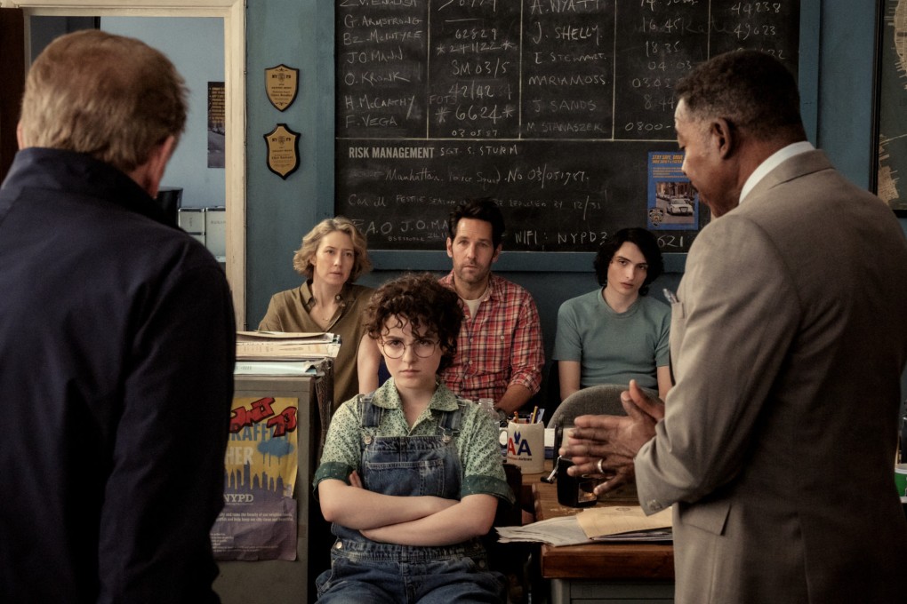 Mckenna Grace (front) as Phoebe Spengler in a still from Ghostbusters: Frozen Empire (category IIA), directed by Gil Kenan. Paul Rudd, Carrie Coon co-star.
