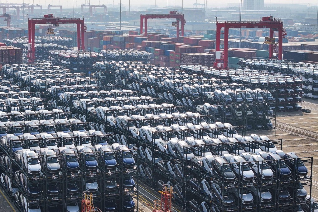 Electric cars wait to be loaded onto a ship in China’s Jiangsu province last month. Photo: AFP