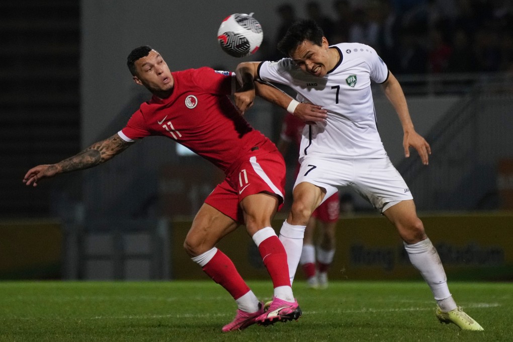 Hong Kong’s Everton Camargo (left) and Uzbekistan’s Otabek Shukurov battle for the ball at Mong Kok Stadium. Photo: Elson Li