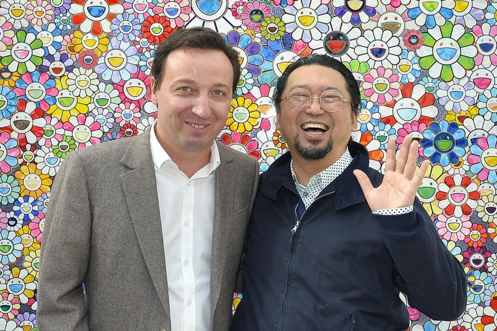 French gallerist Emmanuel Perrotin and Japanese artist Takashi Murakami attend the FIAC International Contemporary Art Fair at Grand Palais, Paris, France, on October 23, 2013. Perrotin has galleries in Paris, Hong Kong, New York, Seoul, Tokyo, Shanghai and Los Angeles. Photo: Getty Images