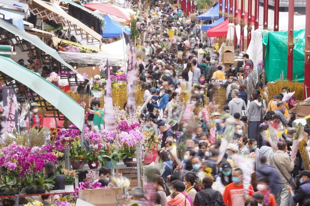 People crowd the Flower Market in Mong Kok to buy flowers ahead of Lunar New Year. The Urban Renewal Authority has revealed plans to radically transform the densely packed neighbourhood. Photo: Winson Wong