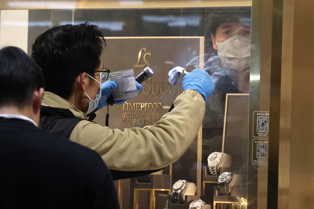 Police investigate at the Legend Success Timepiece store in Foo Ming Street, Causeway Bay on February 28, after it was robbed. Seven watch shops and goldsmiths were robbed last year, up from three in 2022. Photo: Jelly Tse