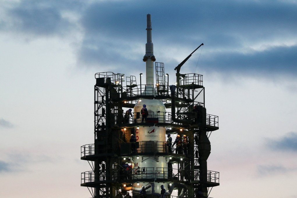 Specialists work near the Soyuz MS-25 spacecraft following its launch cancellation at the Baikonur Cosmodrome, Kazakhstan, on Thursday. Photo: Reuters