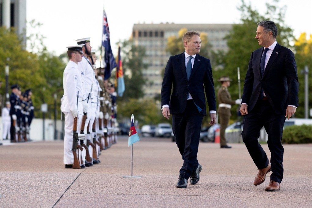 British defence secretary Grant Shapps (left) and his Australian counterpart Richard Marles inspect the guard of honour in Canberra on March 21. Photo: Australian Department of Defence/Reuters