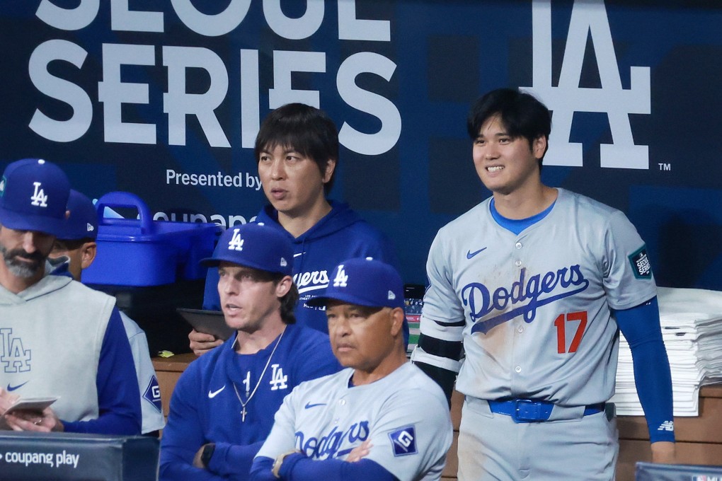 LA Dodgers star Shohei Ohtani (right) and his interpreter Ippei Mizuhara (left) watch the Dodgers’ MLB season-opening game against the San Diego Padres in Seoul. Photo: EPA-EFE